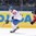 MINSK, BELARUS - MAY 16: Italy's Diego Kostner #22 stickhandles the puck with Canada's Morgan Rielly #24 chasing during preliminary round action at the 2014 IIHF Ice Hockey World Championship. (Photo by Richard Wolowicz/HHOF-IIHF Images)

